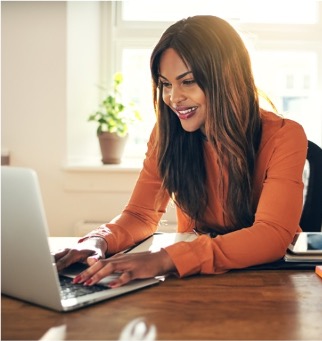 Woman-Smiling-at-Laptop