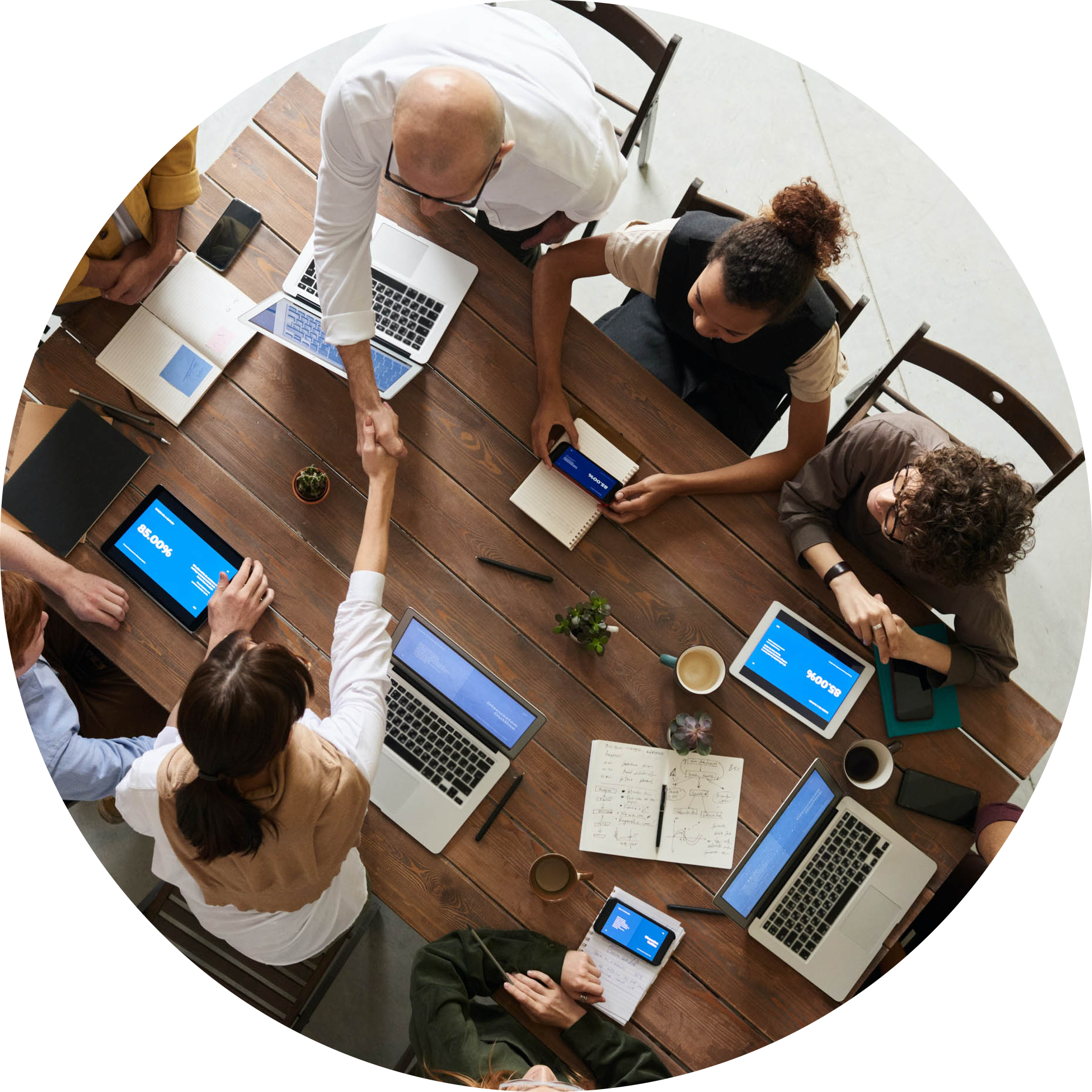 Business-069-overhead-table-shaking-hands-circle.png