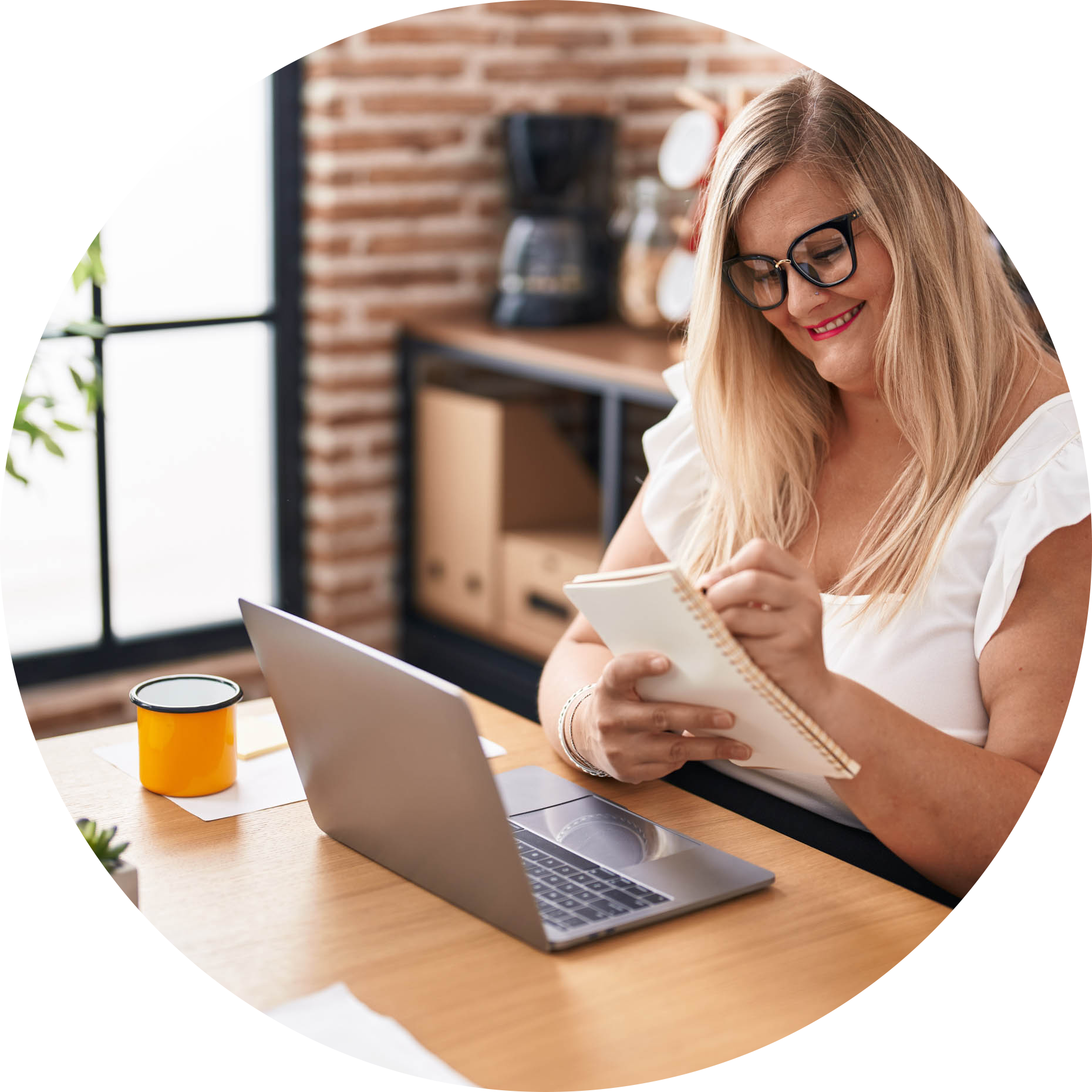 Students-079-Young-woman-business-worker-using-laptop-writing-on-notebook-at-office-circle.png