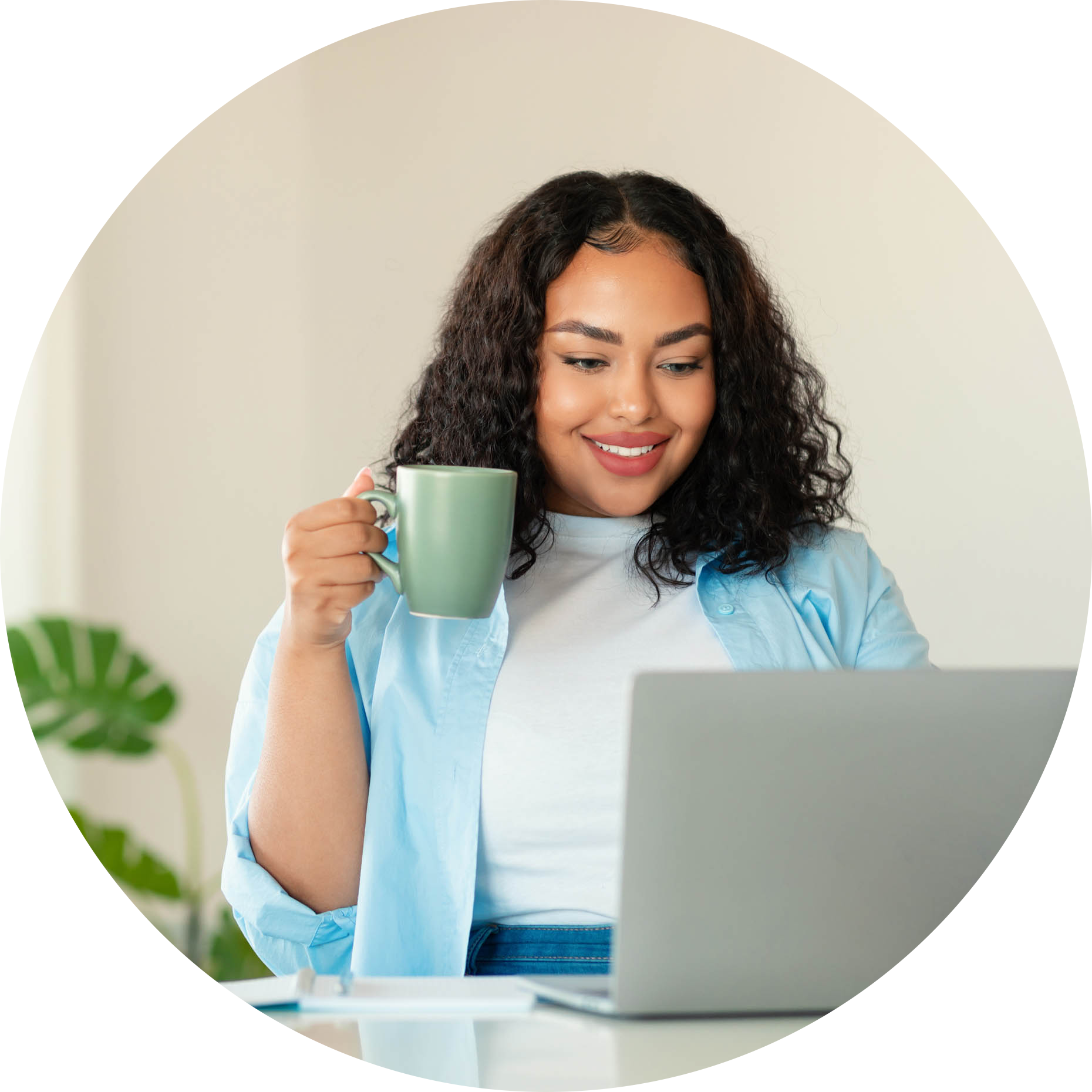 WorkingHome-002-Black-Female-Using-Laptop-Drinking-Coffee-Working-Online-In-Office-circle.png