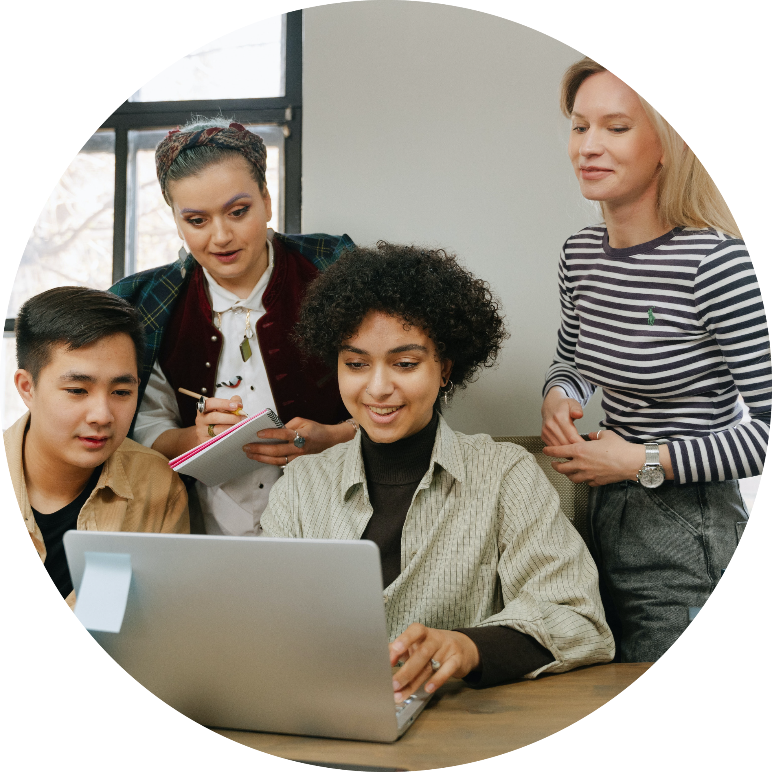 team-huddled-around-laptop-circle.png